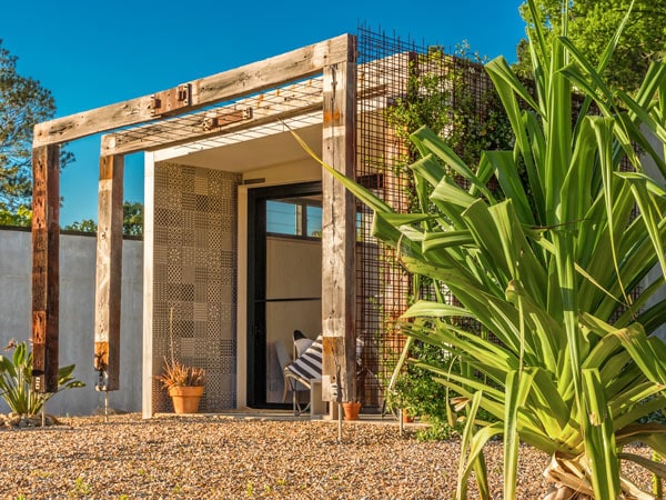 the exterior of environmentally sustainable pavilions made of reclaimed timber at Blackbird Byron, Byron Bay