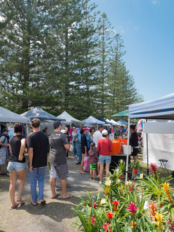 people perusing the stalls at Brunswick Heads Riverside Market