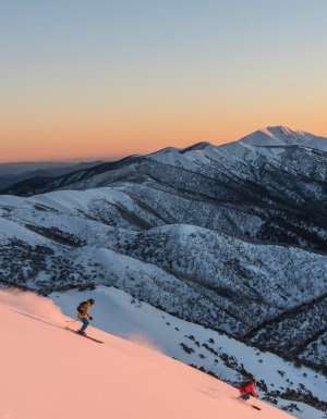 Skiers heading down slopes at Mount Hotham in Victoria
