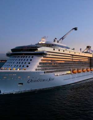 The Royal Caribbean Quantum of the Seas navigating the sea at dusk