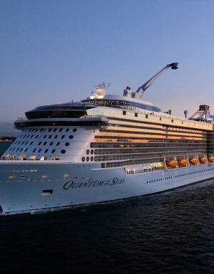 The Royal Caribbean Quantum of the Seas navigating the sea at dusk
