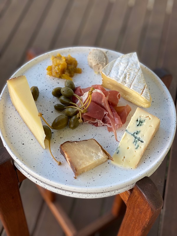 a plate filled of cheese by Kat Harvey
