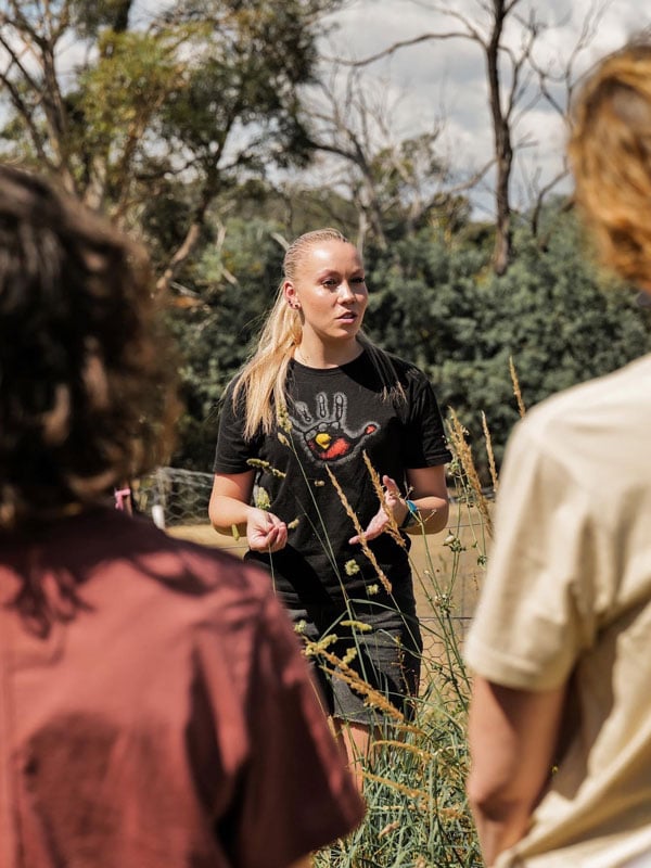 a tour guide leading guests during Kipli Takara Tour