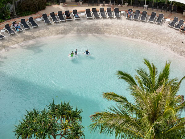 children swimming in the lagoon pool at Mantra Crown Towers Surfers Paradise