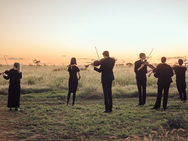 violinists performing during the outback opera