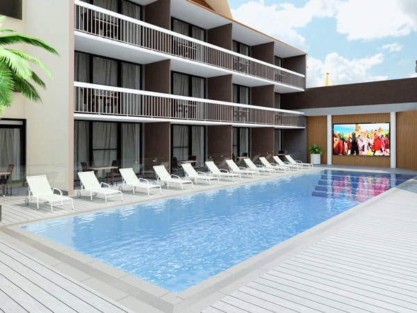 an outdoor pool with sun lounges at Paradise Resort Gold Coast