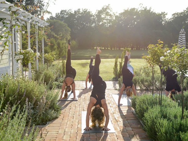 a group of women taking a yoga class