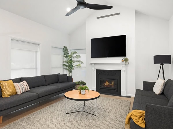 a living room with a fireplace at Abode Accommodations, Mt Gambier