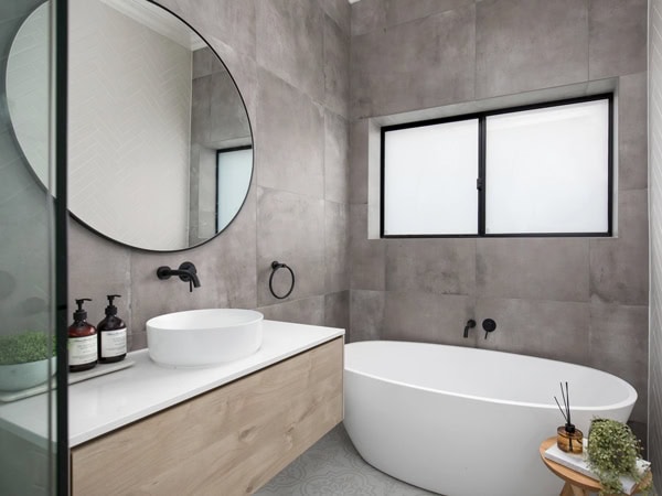 a modern bathroom with a tub at Abode Accommodations, Mt Gambier