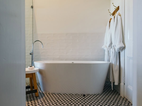 a bathtub and robe hanging inside Colhurst Place, Mount Gambier