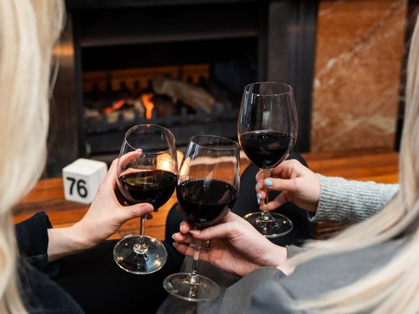 clinking wine glasses at The Cottesloe Beach Hotel