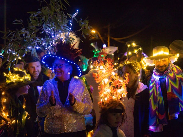 People enjoying the Lightwave Festival in Tasmania