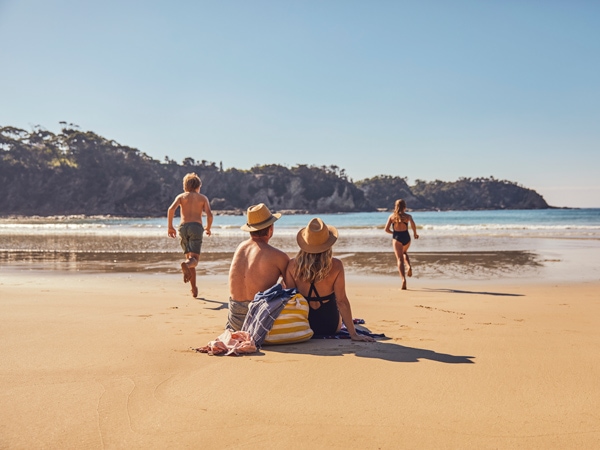 a family spending time at Malua Bay Beach