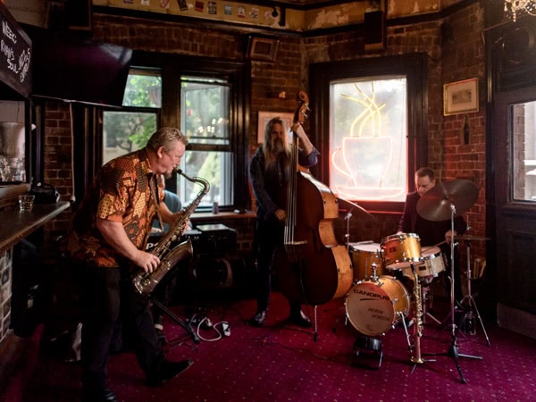 live band playing musical instruments at The Old Fitzroy Hotel, Sydney, NSW