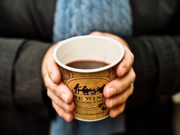 Person holding cup of mulled wine from ReWine