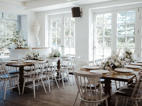 a decorated wedding reception at the sunset room of Watsons Bay Boutique Hotel