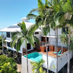 a Coral Sea View Airbnb in Cairns with a pool and balcony