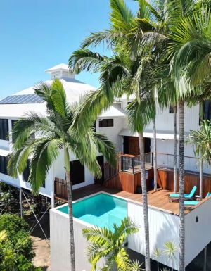 a Coral Sea View Airbnb in Cairns with a pool and balcony