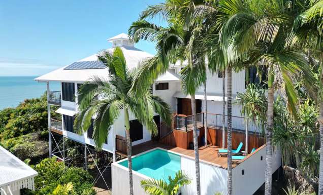 a Coral Sea View Airbnb in Cairns with a pool and balcony