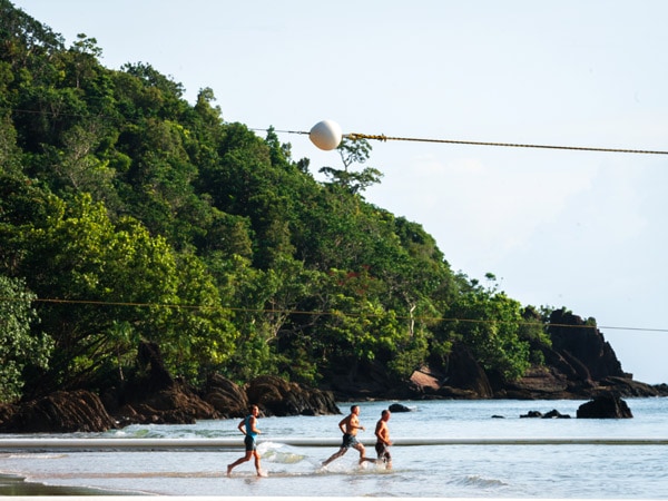 people running into stinger net at Etty Bay, Cairns