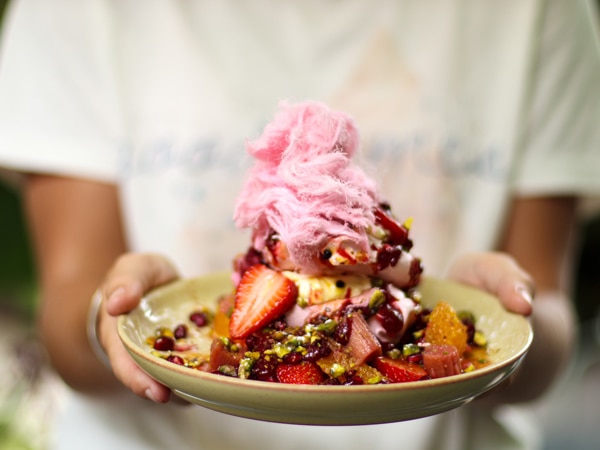a person holding a plate of dessert at Hazelhurst Cafe