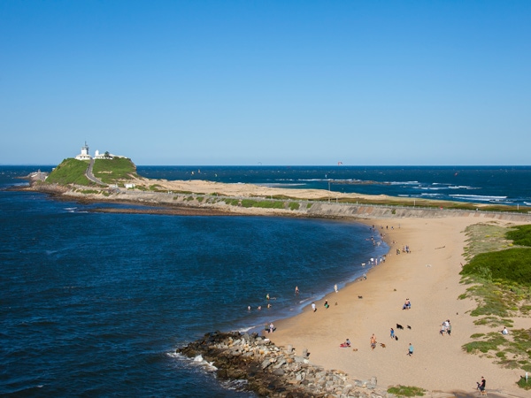 an aerial view of people enjoying at Horseshoe Beach, Newcastle