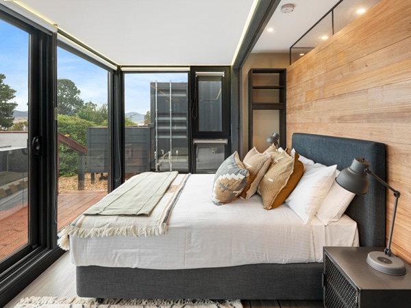 a look inside the bedroom of a glamptainer at NRMA Ocean Beach