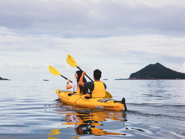a couple kayaking along Karuah River off Jimmys Beach, Hawks Nest, Barrington Coast