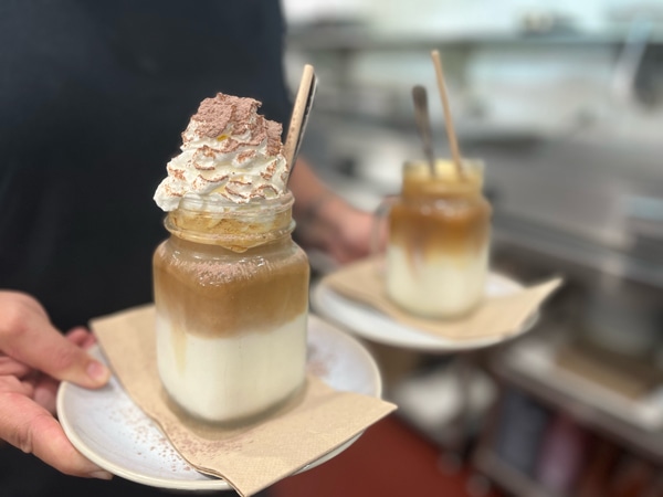 a person holding two servings of frappes at Minnamurra Cafe