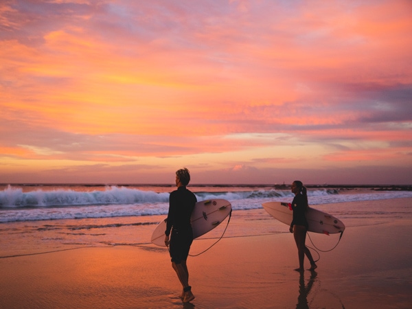 two surfers enjoying a morning in the water off Nobbys Beach, Newcastle