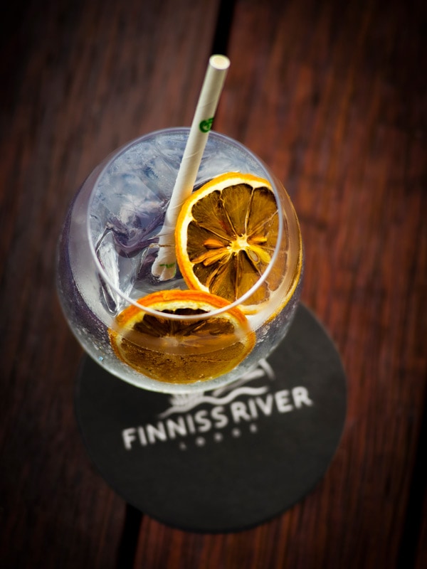 a glass of cocktail on the table at Finniss River Lodge