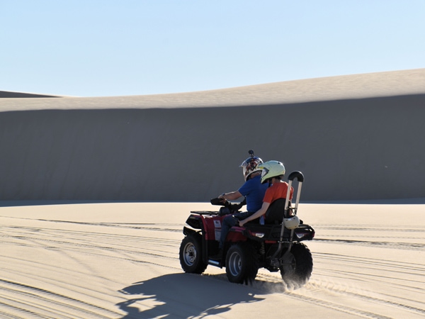 Braeden and Mark Jones on a quad bike