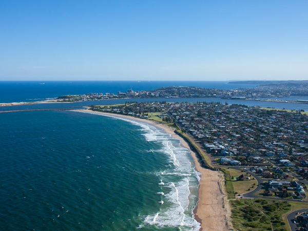 an aerial view of the southern end of Stockton Beach and Newcastle City