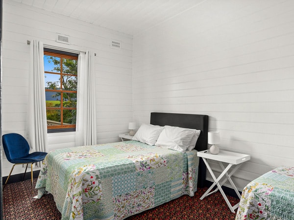a bedroom with window at The Historic Jamberoo Pub