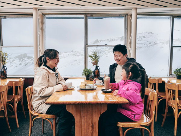 a family dining at Eagles Nest, Thredbo