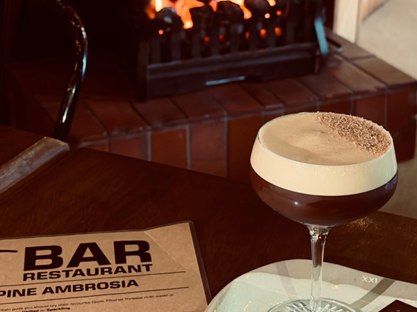 a cocktail by the fire at T Bar Restaurant, Thredbo