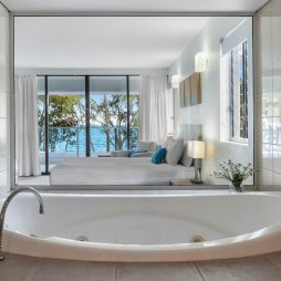 a private tub with sea views at Drift Palm Cove accommodation