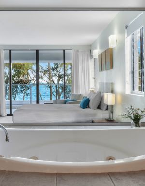 a private tub with sea views at Drift Palm Cove accommodation