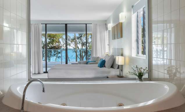 a private tub with sea views at Drift Palm Cove accommodation