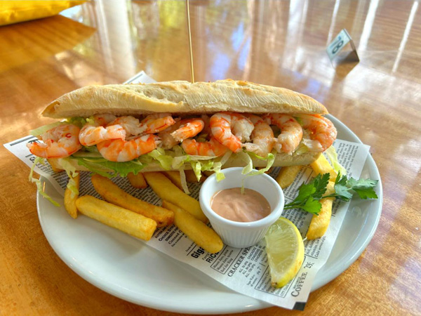 a sandwich loaded with shrimps at Tiger Prawn Tony’s