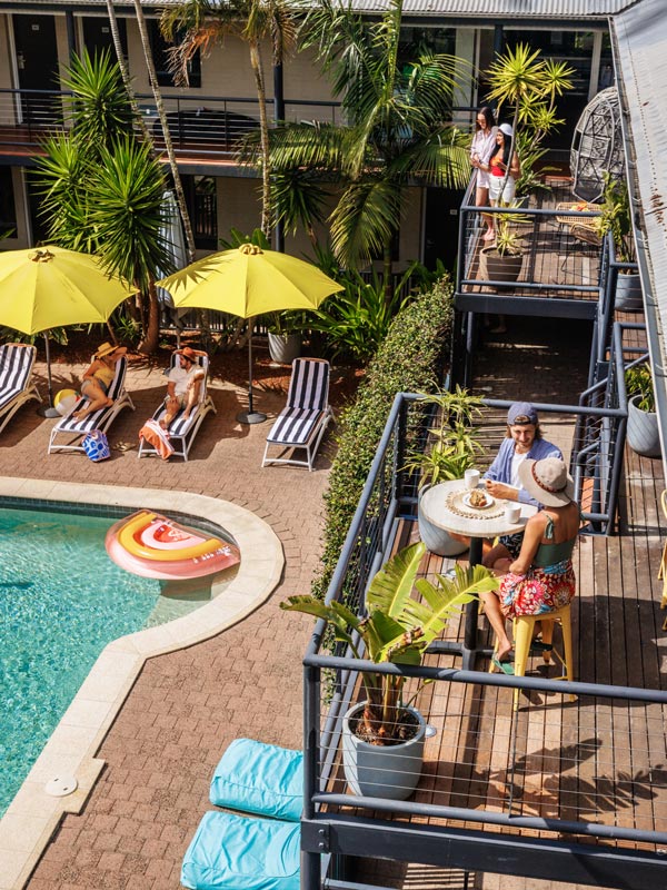 people enjoying at the pool in Byron YHA