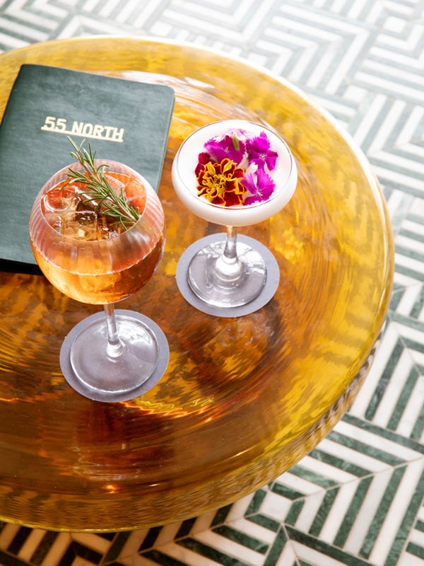 a table-top view of 55 North cocktails at Manly Pacific