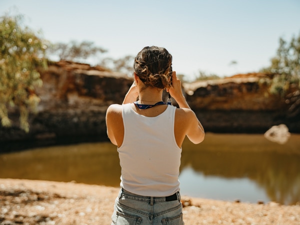 a woman standing on Bilung Pool