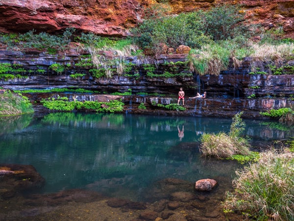 two people enjoying their time in Circular Pool, Karijini National Park