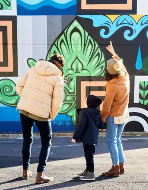 Family admire street art in Braddon Canberra