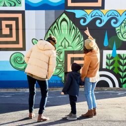 Family admire street art in Braddon Canberra