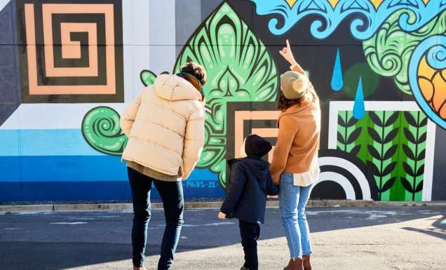 Family admire street art in Braddon Canberra
