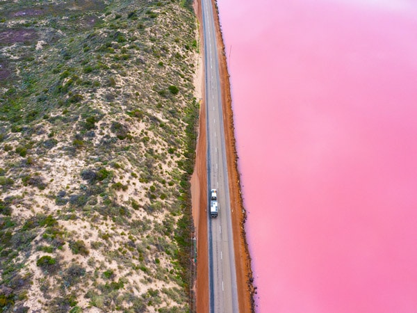 a car driving along Hutt Lagoon, near Port Gregory
