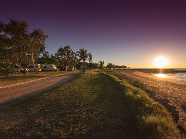 a grassy lawn at sunrise in Roebuck Bay, Discovery Parks Broome