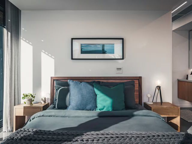 the bed inside the Designer Series Corner Apartment, Braddon